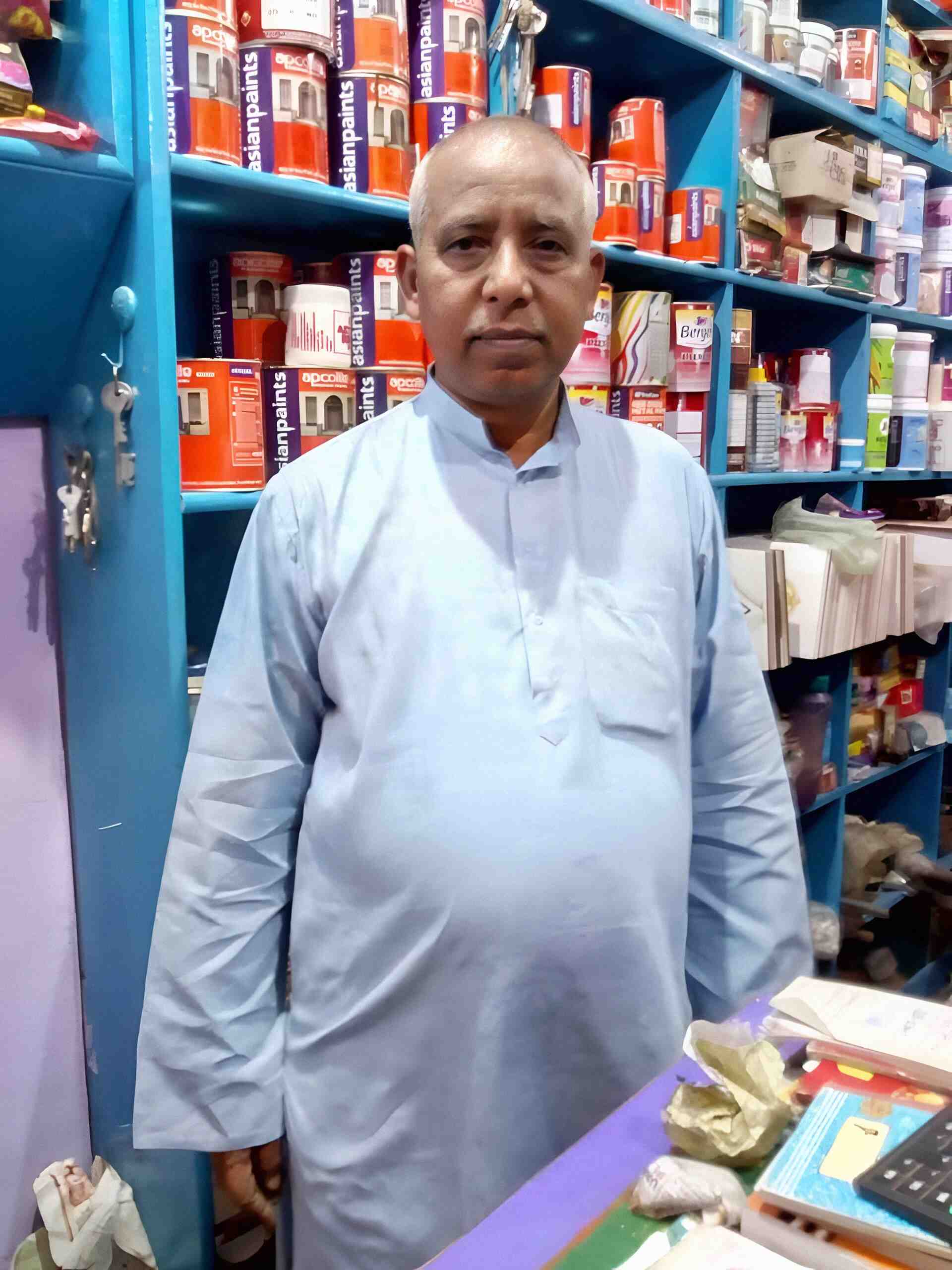 Store owner Dayashankar Chaubey standing in Ajit Hardware & Paint Store